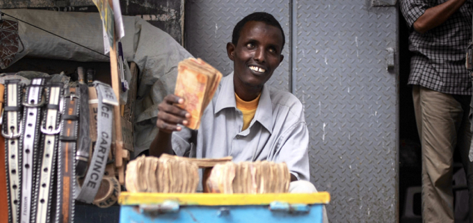 A money exchanger counts Somali shilling notes on the streets of the Somali capital Mogadishu. 